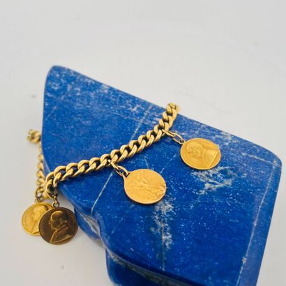 Bracelet en or jaune 18K (750) à maille gourmette...