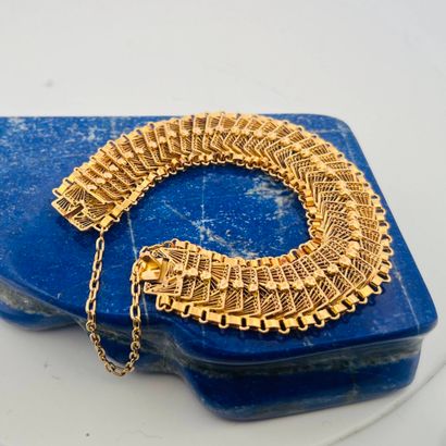 Bracelet souple en or jaune 18K (750) formés...