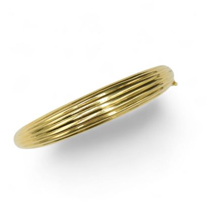 Bracelet ouvrant en or jaune 18k (750).
Tour...