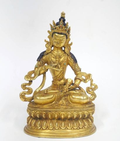 Bouddha soulevant un vajra de la main droite...