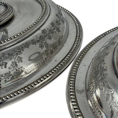 Two oval-shaped vegetable bowls with silver-plated...
