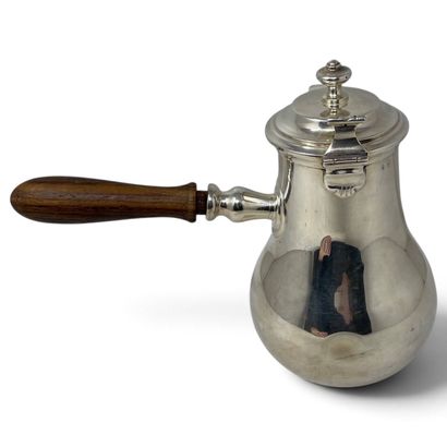 Silver coffee pot with a wooden side handle...