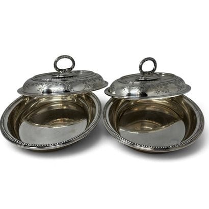 Two oval-shaped vegetable bowls with silver-plated...