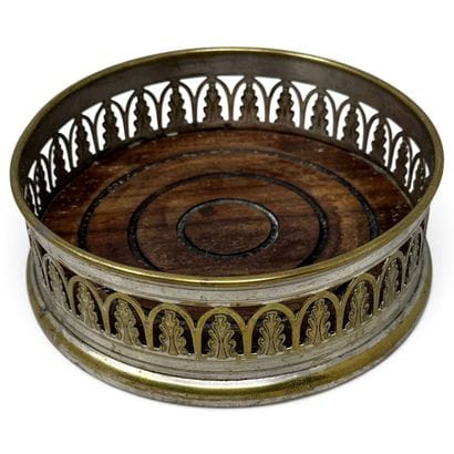 Silver plated metal bottle coaster with an...