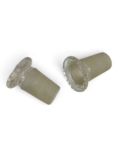 Pair of cylindrical glass bottles with beveled...