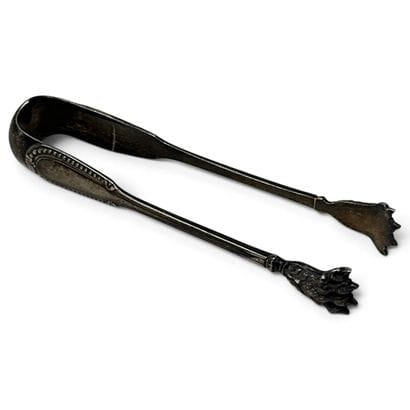Silver sugar tongs, decorated with a row...
