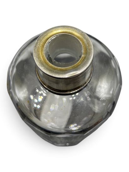 Pair of cylindrical glass bottles with beveled...