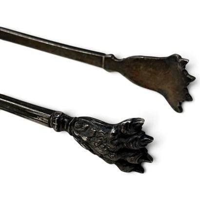 Silver sugar tongs, decorated with a row...