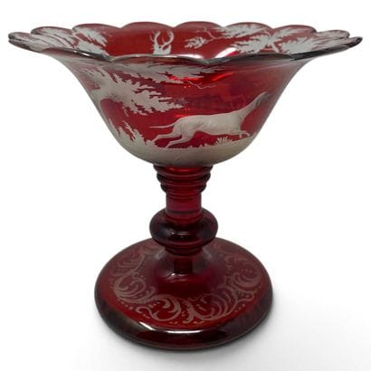 Glass on a red-tinted glass pedestal, decorated...