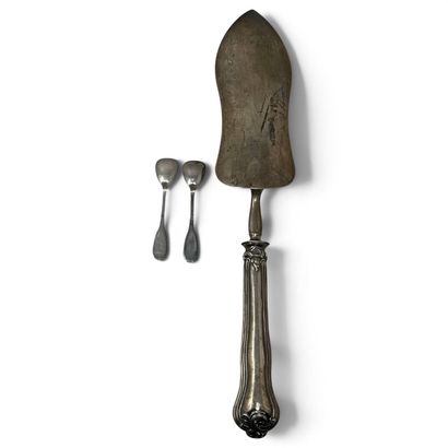A silver serving scoop decorated with a bouquet,...