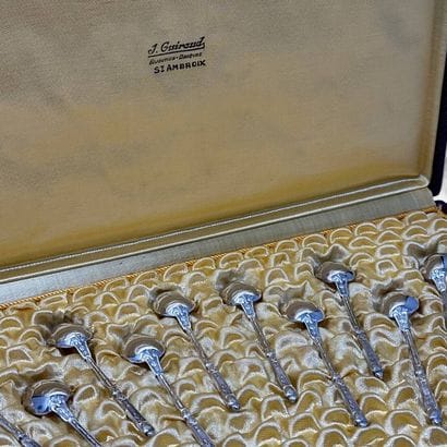 Twelve silver plated mocha spoons with Russian-style...