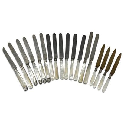 A set of knives with mother-of-pearl handles...