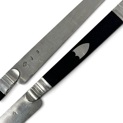 A set of twelve ebony knives with silver...