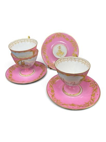 A set of three porcelain cups and saucers...