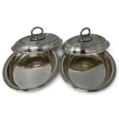 Two oval-shaped vegetable bowls with silver-plated...