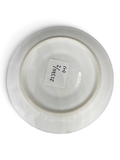 A set of three porcelain cups and saucers...