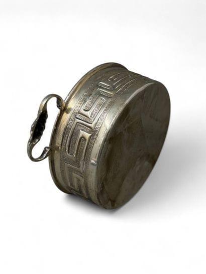 Metal bowl with two handles decorated with...