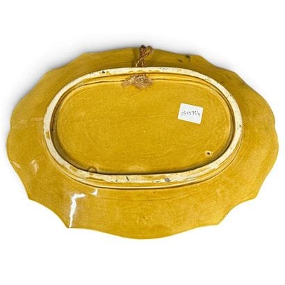 Oval, multi-lobed earthenware dish decorated...