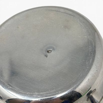 Small silver saucepan with a spout and a...