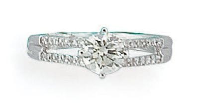 Bague en or gris sertie d'un diamant taillé...