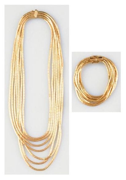 Exceptionnel ensemble en or jaune 18K (poinçonné)...