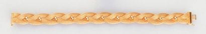 Bracelet tressé en or jaune 18K (poinçonné),...