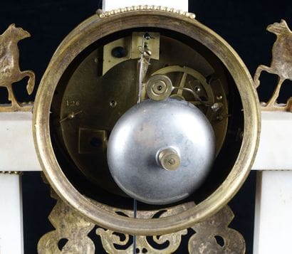 Pendulum in white marble and gilded bronze...