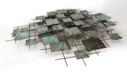 Brass and bronze with grey-green patina wall...