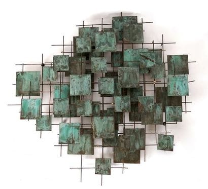 Brass and bronze with grey-green patina wall...