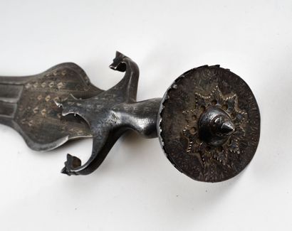 Persian sword. Iron mount nielloed of silver.

Half...