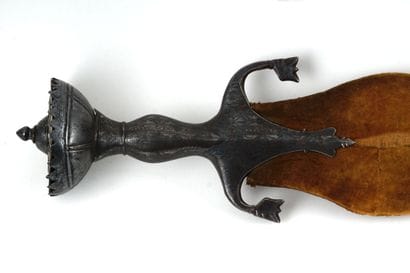 Persian sword. Iron mount nielloed of silver.

Half...