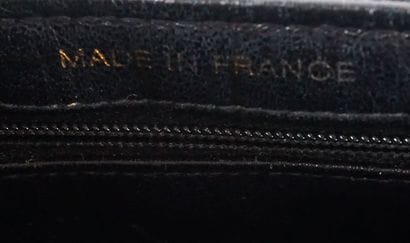 CHANEL
Double-sided Chanel bag in black patent...