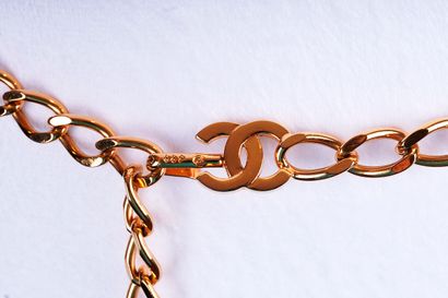 CHANEL
Two (2) Chanel gold belts, one composed...