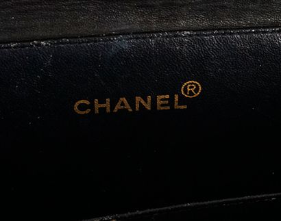 CHANEL
Double-sided Chanel bag in black patent...