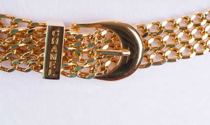 CHANEL
Two (2) Chanel gold belts, one composed...