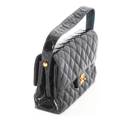 CHANEL
Double-sided Chanel bag in black patent...