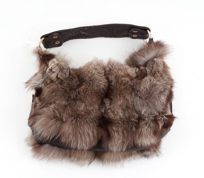 SAC FOURRURE
Sac porté épaule en cuir et...