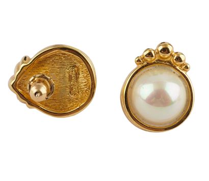 CHRISTIAN DIOR
Broche et paire de boucles...