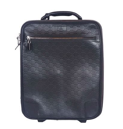 GUCCI
Gucci monogram leather rolling suitcase...
