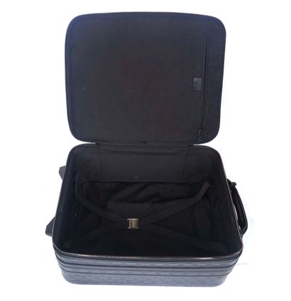 GUCCI
Gucci monogram leather rolling suitcase...