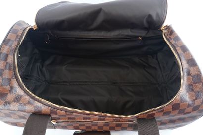 LOUIS VUITTON
Louis Vuitton rolling duffel...