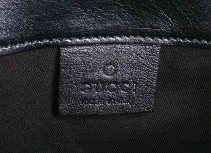 GUCCI
Large Gucci clutch in black Monogrammed...
