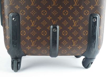 LOUIS VUITTON
Louis Vuitton rolling suitcase...