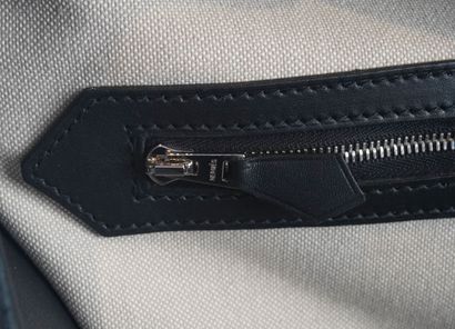 HERMÈS 
Hermès travel bag in gray canvas...