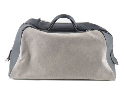 HERMÈS 
Hermès travel bag in gray canvas...