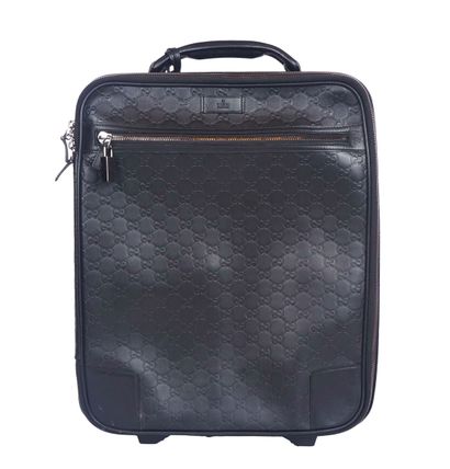 GUCCI
Gucci monogram leather rolling suitcase...