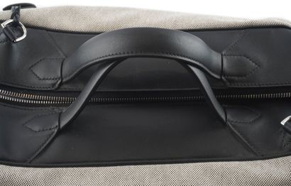 HERMÈS 
Hermès travel bag in gray canvas...