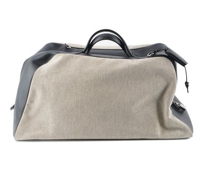 HERMÈS 
Hermès travel bag in gray canvas...