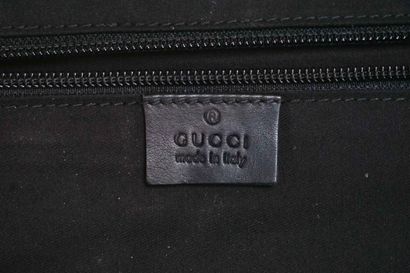 GUCCI
Gucci monogram leather rolling suitcase...