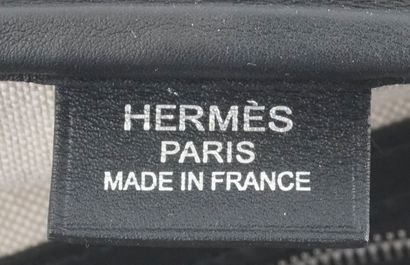 HERMÈS 
Hermès travel bag in gray canvas...